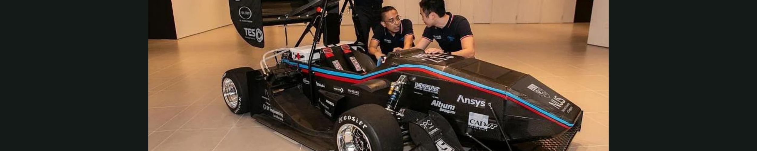NUS students with electric race car