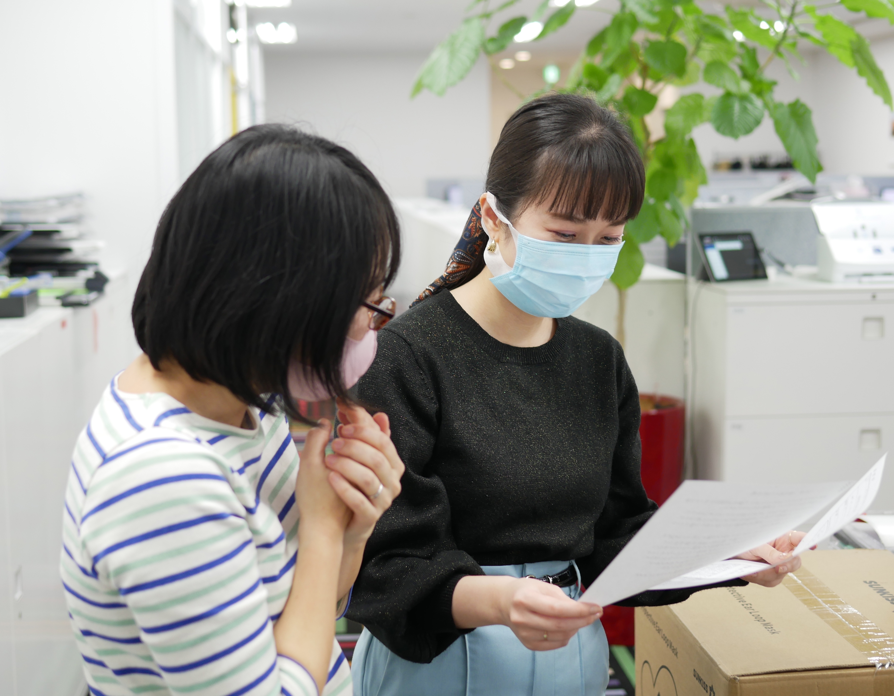 TES Japan - Staff members reviewing documents 