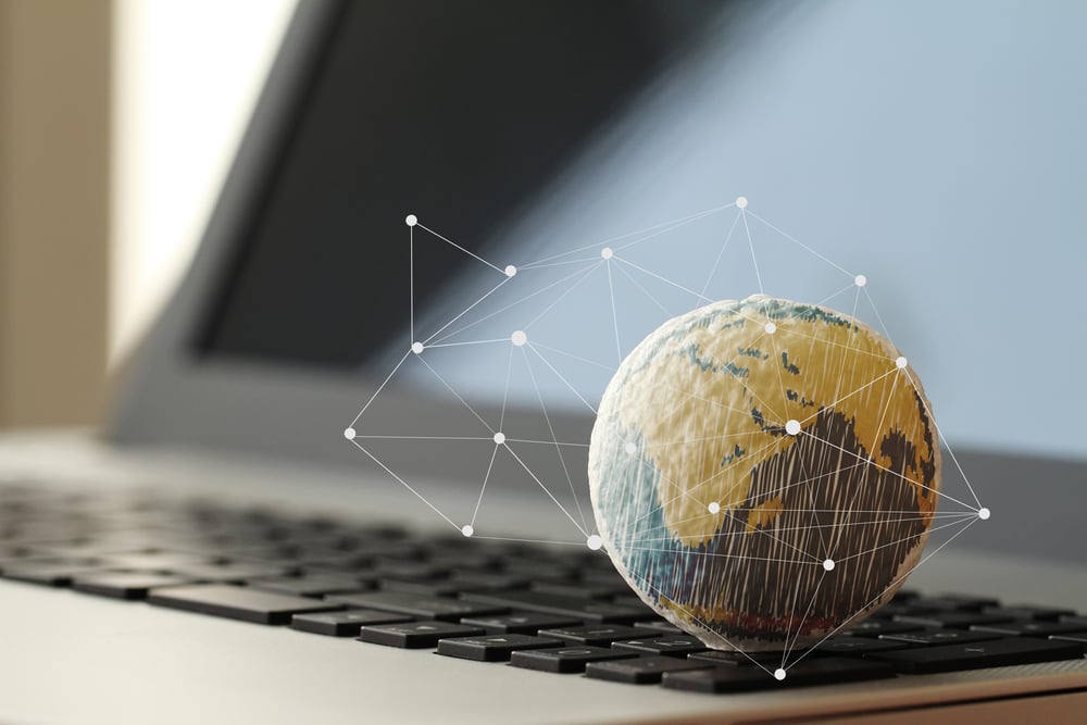 Image of a laptop and a globe
